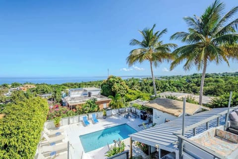 Tropical vibes meet total relaxation at the pool. It’s where sun, shade, and island living come together. 