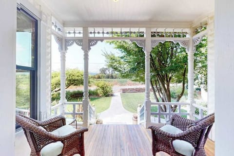 Settle into your private Victorian porch with wicker seating and gaze across the manicured Healdsburg garden — the perfect spot to sip your morning wine country coffee.