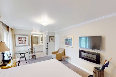 Take in the full scope of your Silverado suite — from your king bed and fireplace to the intimate dining nook and open vanity area, every detail invites relaxation.