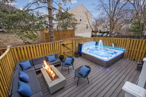 Unwind after a long day in your private hot tub, surrounded by a fenced backyard and peaceful outdoor living space.