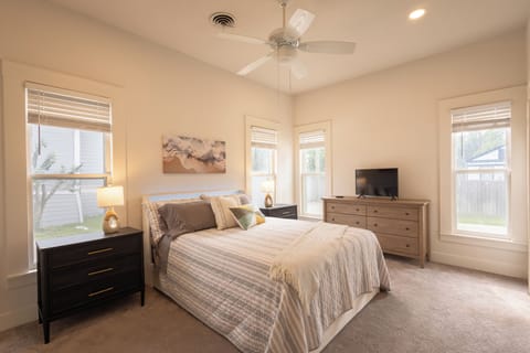 A cozy, inviting suite with attached bath and tv. 