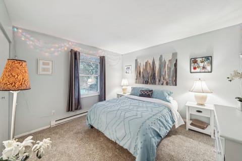 Enjoy the beautiful queen bedroom overlooking the neighborhood.