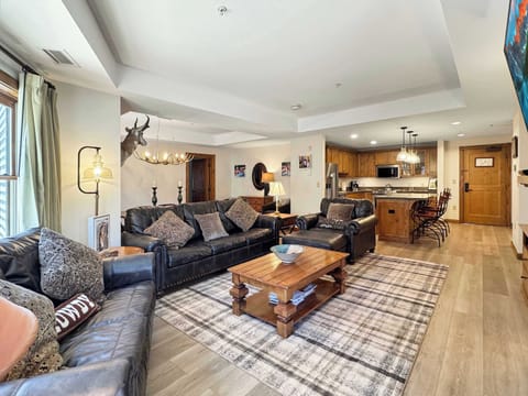 Room for the whole family to relax around a fireplace | Listed with @BookTraverse