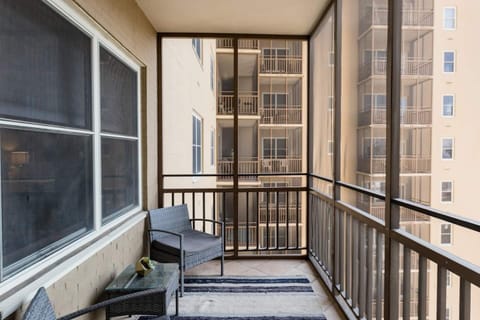 Private balcony w/ cozy seating & outdoor rug for laid-back mornings