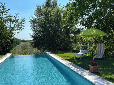 Seasonal outdoor pool, open 9:30 AM to 7:00 PM, pool umbrellas