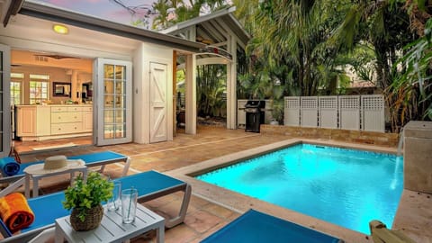 Your private tropical escape awaits—dive into the sparkling pool, lounge on the sun-kissed patio, or fire up the grill for an unforgettable evening under swaying palms.