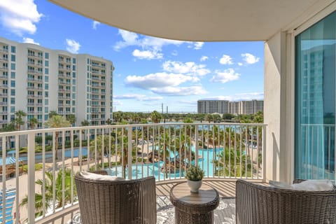 Step onto your private balcony and soak in stunning pool views framed by swaying palms and sunny skies—your perfect spot for morning coffee or evening relaxation.