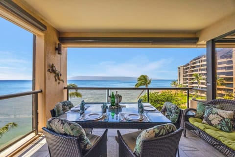 This outdoor dining setup pairs comfortable seating with breathtaking ocean views for unforgettable meals