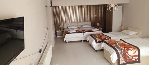 Family Quadruple Room | Minibar, in-room safe, free WiFi, bed sheets