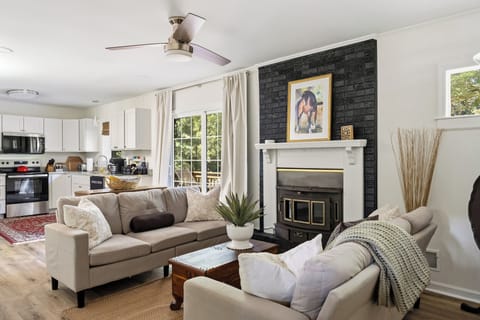 Family Room off kitchen;  wood burning fireplace and plenty of seating for conversation, ceiling fan, light blocking drapes