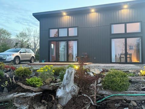Front of house facing forest with view of Pubnico Harbour.