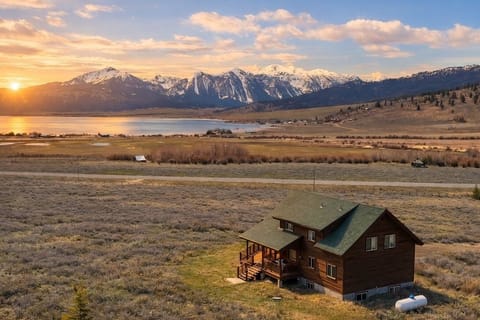 Sunset over Henrys Lake with your cabin & snowy peaks beyond