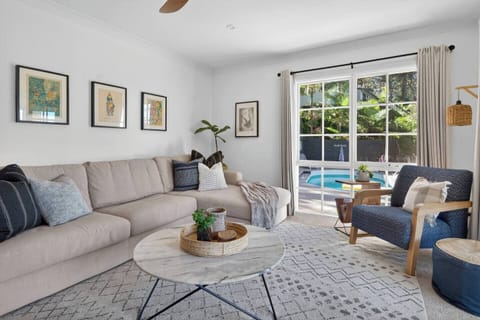 Settle into a quieter retreat where gentle light and views toward the pool create a soothing place to unwind.