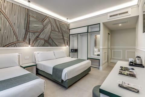 Deluxe Triple Room | In-room safe, desk, laptop workspace, blackout drapes