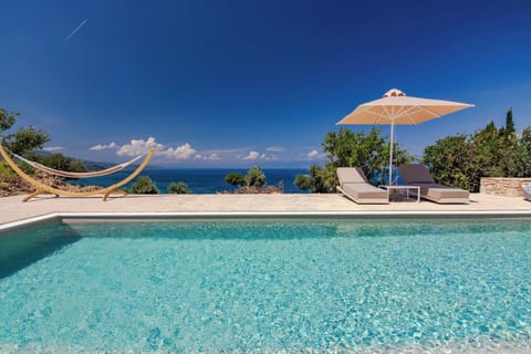 Crystal-Clear Infinity Pool Overlooking the Sea