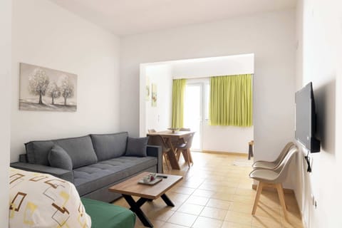Bright and welcoming living room with direct access to the balcony
