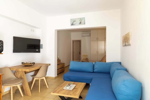 Bright living area with comfy sofa and dining space