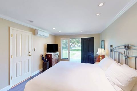 Stretch out in your spacious king suite with flat-screen TV and climate-controlled comfort — glass doors open to Silverado's lush resort grounds.