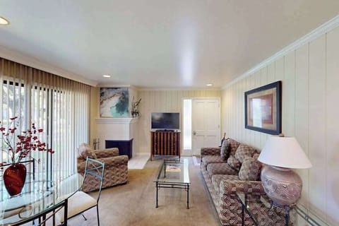 Settle into your stylish Napa Valley living room with plush seating, a cozy fireplace, and flat-screen TV — the perfect spot to unwind after a day of wine tasting.