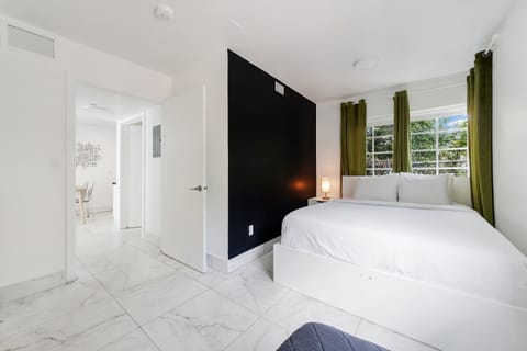 Family Apartment, 2 Bedrooms, Balcony (Self check-in) | Desk, laptop workspace, blackout drapes, iron/ironing board