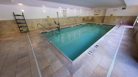Plunge into relaxation in a tranquil indoor swimming pool.