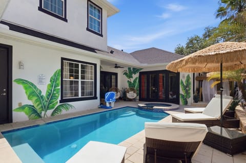 Resort-style outdoor living with tropical murals and a fully private setting.
