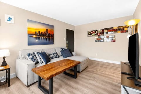 Living room — skyline art, comfortable seating, and space for two