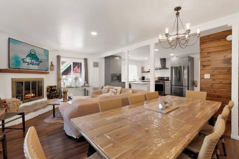 Gather around the dining table which seats the whole group comfortably perfect for big meals and good company.