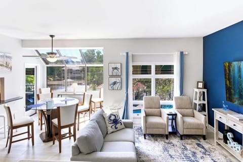 The flow you'll love: dining, lounging, and lagoon-facing windows all in one airy great room, perfect for groups and families.