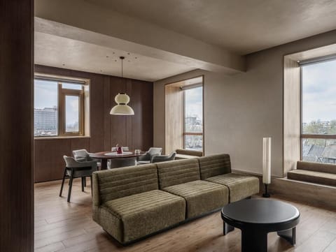 Deluxe Suite, City View | Living area | 65-inch TV with digital channels