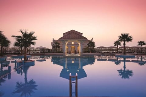 Outdoor pool, open 9:00 AM to 9:00 PM, pool umbrellas, sun loungers