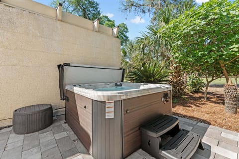 Private hot tub surrounded by tropical landscaping — the perfect place to unwind after the beach or golf