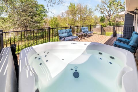 Soak your worries away in this private hot tub while surrounded by peaceful treetops and comfortable deck seating.
