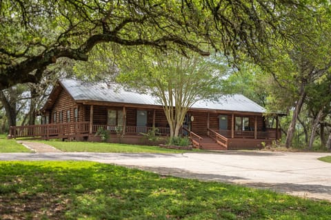This property features the iconic rustic log house, a timeless structure with two private wings.