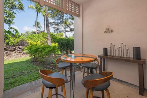 Your private terrace opens to lush tropical gardens where you can savor morning coffee surrounded by swaying palms and verdant greenery.