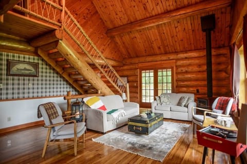 The living room with soaring 30 ft ceilings 