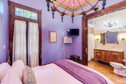 Another view of the bedroom highlighting ornate decor and a warm, inviting ambiance.