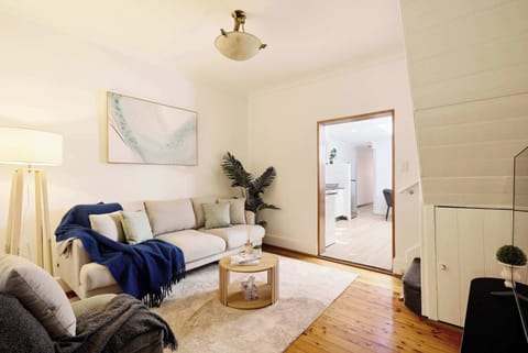 A bright and inviting living space that perfectly balances modern comfort with classic architectural charm.