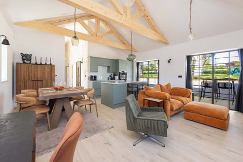 Spacious Chichester countryside lodge with vaulted beams, open-plan living, modern kitchen, and relaxing Goodwood-ready style.
