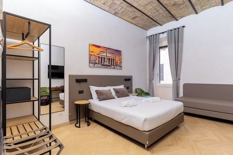 Deluxe Triple Room, Courtyard View | Minibar, in-room safe, desk, soundproofing