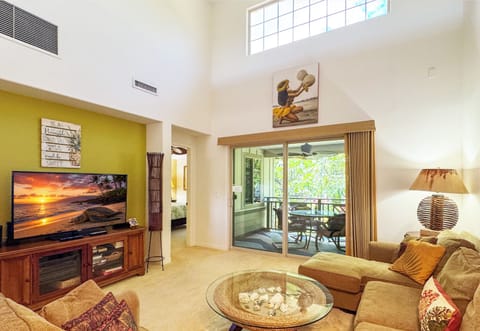 Open living room with loft ceiling.