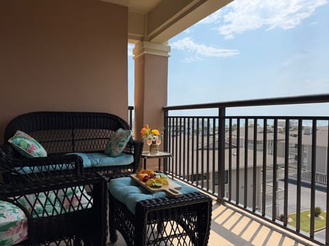 Unwind on your private balcony with cozy wicker seating and refreshing snacks while soaking up panoramic views.