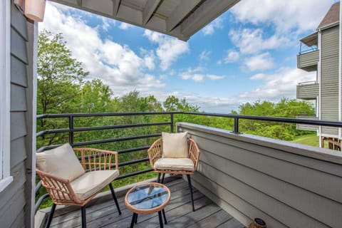 Sip your morning coffee on your private balcony with sweeping views of lush greenery and blue skies—the perfect spot to unwind and breathe in fresh air.