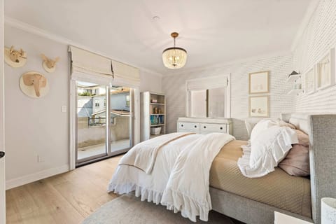 This serene bedroom offers soft textures, natural light, and a calm place to unwind.