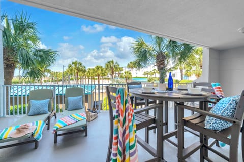 Sip your morning coffee while soaking in stunning pool and palm tree views from your private covered balcony.