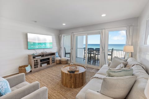 Sink into plush coastal comfort while gazing at endless ocean views from your private living space, where beach-inspired décor meets modern luxury.