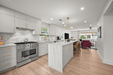 Bright, modern kitchen with full-size appliances and ample counter space.