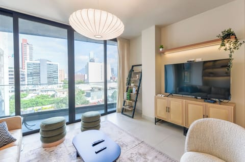 Deluxe Suite, City View | Living area | 44-inch Smart TV with digital channels, streaming services
