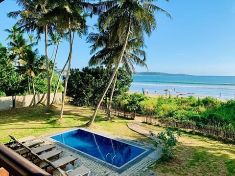 Outdoor pool, free cabanas, pool umbrellas