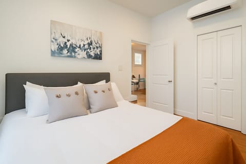 Cozy bedroom with a plush queen bed and high-quality linens.